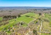 An exceptional 68 acre property on the highly sought after Quaker Hill of Pawling. The parcel features 24 acres of clear and level land seamlessly blend with old woods crossed by meandering streams and historic trails dating back to the revolutionary era. Nestled in Quaker Hill&rsquo;s esteemed equestrian community, this property offers panoramic views of neighboring mountains and expansive estates. The possibilities here are vast: build your dream home amidst breathtaking vistas, utilize the ample cleared space (formerly a grass airstrip) for livestock grazing or horse paddocks, construct barns or a caretaker&rsquo;s cottage, and explore the 40 acres of wooded terrain with UTVs or hiking expeditions. With over 730 feet of frontage along Tracy Road and an entrance at a bend in Old Quaker Hill Road, the drive unfolds through cleared land leading to a spacious open area perfect for a residence, overlooking a vast pasture with unobstructed 360-degree views. This land, once an airstrip, now zoned as a horse farm by the town, showcases its equestrian potential with ample room for paddocks. Additionally, there is potential for subdivision, offering the opportunity to create two additional lots. Located just minutes from the charming Village of Pawling with its array of restaurants, bakeries, shops, pubs, and a Metro North station for convenient travel to NYC.