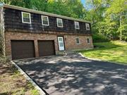 Newly Renovated 4 Bedroom 2 Bath Hi Ranch w/ 2 Car Attached Garage and Mother/Daughter Possibilities. It is Located in the Heart of Beautiful Northport, on Nearly 1/2 Acre, & with a Desirable Mid Block Location. This Home has a Brand New White Shaker Gourmet Kitchen w/ a Stainless Steel Appliance Suite, Marble Inspired Quartz Counter Tops, & a Custom 5 foot Quartz & White Shaker Island. The Open Floor Plan Boasts a Huge Living Room w/ Vaulted Ceilings and an Oversized Dining Room that has a Brand New Pella Sliding Door w/ Built in Privacy Shades. The 2nd Floor has Gleaming Oak Floors Throughout. The Newly Renovated Full Bath has a Bath & Shower Combination, Marble Like Porcelain Tiles, an Elegant Shower Niche, & Custom Marble Vanity. The Spacious Master Bedroom has 2 Large Closets & a Brand New Anderson Window. There are also 2 Additional Large 2nd Floor Bedrooms. The First Floor M/D Suite has an Open Floor Plan & Endless Potential. The Suite has a Beautiful Kitchen w/ Stainless Steel Appliances, Granite Countertops, & a Custom Made Wood Block Island. The Living Room has a Wood Burning Fireplace & Custom Brick Work. The Dining Room has Views of the Large Front & Side Yards. The Very Large Master Bedroom has views of the Front Yard. The Full Bath has a Bath & Shower Combination & Marble Vanity. This Suite has its Own Side Entrance for Privacy. Additionally, this Home has a Large Entry Hall w/ a Curved Staircase, & a New Chandelier. The EH has New Wood Like Porcelain Floors, a Discreet Washer & Dryer w/ Folding Doors, & Direct Access to the 2 Car Attached Garage. The 2nd floor has its Own CAC Unit & the 1st floor Suite has 2 Mini-Split AC Units. This Northport Home is in a Prime Location. It is close to the LIRR as well as Wineries, Restaurants, & Beaches. It is in the Highly Acclaimed Northport School District.