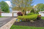 This captivating four bedroom split-level home showcases an appealing front-to-back layout, featuring beautifully finished wood floors, a fenced-in yard, and stunning curb appeal. Offering generously proportioned rooms and a seamless flow from the front to the rear of the property, this home is designed to impress with vaulted main level ceilings, and a huge master bedroom walk-in closet. The front to back styling offers the potential for versatile living arrangements. Updated and meticulously maintained, move-in ready for the next buyer. All info contained herewithin needs to be confirmed and independently verified.