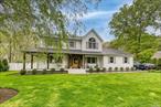 Welcome to this picturesque home, where charm meets tranquility on a serene cul-de-sac offering stunning sunset views over the adjacent sod farm. Adorned with a welcoming wrap-around porch, this home is a testament to timeless beauty and modern comfort. Step inside to discover a seamless blend of sophistication and convenience, with hardwood floors gracing every corner, Anderson windows and the added luxury of heated flooring. The heart of the home, an expansive Eat-In Kitchen (EIK), boasts granite countertops, stainless steel appliances, and ample space for culinary creativity. A focal point of warmth and elegance awaits in the living area, featuring a magnificent custom wood front door and a cozy fireplace adorned with a pellet stove insert, perfect for intimate gatherings or peaceful evenings. Indulge in the spaciousness of the bedrooms, with cathedral ceilings enhancing the allure of the master suite, complete with a walk-in custom closet for added convenience. Outside, the generous yard beckons for entertainment and relaxation, featuring a shed for storage, a swing set for playful moments, and a large built-in sandbox for endless enjoyment. House is equipped with solar panels. Enjoy the outdoors year-round with a new expansive paver patio, complete with a fire pit for cozy gatherings, and an in-ground saltwater pool for refreshing dips on hot summer days. For added versatility, the separate entrance to the full finished basement presents mother-daughter opportunities or the potential for additional living space tailored to your needs. Experience the epitome of luxury living and embrace the tranquility of this exceptional home, where every detail is crafted for comfort, convenience, and cherished moments with loved ones.  Conveniently located near wineries, beaches, Tanger outlets, and all the attractions the North Fork has to offer.