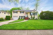 Spacious split level home located on quiet tree lined block in the desirable Mott section. This gem is situated on a generous and well manicured 65x125 lot The welcoming foyer that a great coat closet and transitions into an open floor plan featuring a living room, dining room and eat in kitchen. The lower level has a large family room great for entertaining guests or relaxing with family. A laundry room and half bath complete this level. The upstairs boasts a primary bedroom with full ballroom with shower. There are 2 additional nicely sized bedrooms and a full hall bathroom with shower on this level. The basement is a great recreation space and room for an office as well. Central AC runs throughout the house ensuring comfortable living.