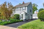 Welcome to the inviting charm of this 3 bed / 1.5 bath Colonial farm-style home in the West Village of Westbury! Step inside this picturesque, sunlit home and discover a warm and spacious living area with hardwood floors, high ceilings with custom crown molding, beautiful original stained-glass, and so much more! The 1st floor layout flows seamlessly from room-to-room and incorporates aesthetically pleasing colors and design! The brick fireplace in the living room is perfect for cozy gatherings, and the adjoining den provides additional space for quiet relaxation. A large formal dining room offers a place for family and friends to make cherished memories, while enjoying the view of lovely perennial gardens from the sliding glass doors leading to the lush backyard. The second floor boast 3 spacious bedrooms with hardwood floors, a stylish full bath, and a walk-up attic provides additional space for storage. This oversized corner property and the beautiful gardens that frame the home provide a tranquil retreat for outdoor entertaining and leisure. Amenities include new Energy Star appliances, programmable Nest thermostat, new windows (10 yrs), and a detached 2-car garage. With its timeless appeal, this home promises a lifestyle of comfort!