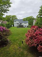 Located on a quiet, tree-lined street and meticulously manicured, this 2-family home offers five bedrooms and three bathrooms and is currently set up as a mother-daughter with additional kitchen area and a separate entrance. This home is flooded with light and features a formal dining room, family room with fireplace and formal living room, oak floors, skylights, balconies and a waterfall feature in one of the many garden areas. The primary suite includes an en-suite bathroom with a jetted tub, water closet, shower and double sinks. Additional features include a large two-car garage, double closets, four heating zones and central A/C. Enjoy tons of storage with bonus room and workshop, along with on-demand hot water, central vacuum and a clean dry basement. Convenient to Smithhaven Mall, public transportation and Stony Brook University Hospital.