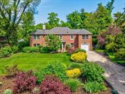 Brick Beauty! Stately 4 bedroom/3.5 bathroom Center Hall Colonial proudly set on a lushly landscaped, expansive flat property on one of the best streets in Port Washington Estates. Southern exposure floods the house with light, and you feel the warm embrace as you enter the welcoming foyer. All the rooms you need and expect: formal living room with wood burning fireplace and built-in shelving, large den/office with glass doors and access to yard. Dining with French doors to blue stone patio. Custom eat-in-kitchen with fabulous prep pantry with tons of counters, storage, refrigeration drawers and additional sink. Impressive primary suite with wood-burning fireplace, huge walk-in-closet and spa bath. All 3 additional 2nd floor bedrooms and 2 full baths are spacious and well appointed. 2nd floor laundry. Full basement with recreation, storage, mechanicals and OSE. Walk-up attic. CAC. Attached one car garage. Association beach and mooring with applicable fees. Quiet, private and meticulously maintained this is, simply put, and exceptional home.