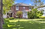 Enjoy this three-bedroom brick colonial with a huge park-like backyard on a 51 x 163 lot. There is also a bonus lot to the right of the home. The rear of the home has a circular driveway. This home features hardwood floors, a fireplace, a stainless steel stove,  formal living room and dining room, breakfast nook, an eat-in kitchen, and office space. The first-floor half bath is updated, and the second-floor bathroom is renovated.