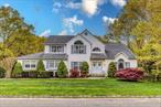 Welcome to this stunning 5-bedroom, 3.5-bathroom colonial home. Enter through the grand foyer with soaring cathedral ceilings that continue into the formal living room. The large eat-in kitchen offers serene views of the lush yard and adjoins a cozy den, perfect for family gatherings. The first floor features a versatile 5th bedroom, an additional living room and kitchen, providing ample space for various needs. Upstairs, four spacious bedrooms, an additional full bath and generous master suite with an ensuite bathroom. The backyard is a private paradise with an inground swimming pool and sprawling deck for entertaining. Backing up to state land, the property offers unparalleled privacy and picturesque views.