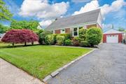 Welcome to this updated 4 bedroom single-family cape in Uniondale, NY, Long Island. Step into this move- in ready property featuring a spacious interior with hardwood floors, base/crown molding, and recessed lighting throughout. The 1st floor offers 2 spacious bedrooms, 1 fully updated bathroom, a comfortable living room, and a dining room. The fully updated kitchen showcases white quartz countertops, stainless steel appliances, laminate floors, and a convenient breakfast nook. The kitchen provides access to both the backyard through a sliding glass door and the driveway through another entrance. Upstairs, the 2nd floor has 2 additional bedrooms with clever storage solutions. The expansive 6, 600 square feet lot includes a 1 car garage and ample outdoor space for relaxation and entertaining with well-manicured landscaping, including a Japanese Maple tree and rose bushes. Other highlights: 200 amp electric, Split A/C units in some rooms, 2 zone heating and custom blinds included. The property is conveniently located within close proximity to public transportation, shops, restaurants, parks, schools, and places of worship.