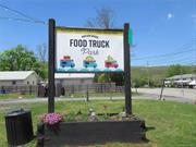 A unique investment opportunity awaits! Mid-Hudson Valley&rsquo;s first food truck park located on a high-traffic State Route 17A in the charming Village of Greenwood Lake, offers a picturesque lakefront setting and convenient access for boaters. The property features a corner lot with a 288 square foot building, complete with a drive-up window and kitchen equipment, including a natural gas range, deep fryer, exhaust hood, Ansul system and commercial sink. The food truck area is permitted for up to five vendors, with five pedestals providing 30 amp and 20 amp electric service, and seasonal water access. Capitalize on the popularity of the Warwick Valley attractions and Greenwood Lake, a seven-mile long lake that draws in visitors year-round for boating, swimming, ice skating, fishing, and taking in the breathtaking scenery. If you are ready to spice up your life with a food truck adventure, look no further than this food truck park. The perfect spot to bring your culinary dreams to life.