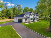 Newly constructed, this Post Modern home has 3400 square feet of living space on a 38, 352 square foot lot within Mt. Sinai&rsquo;s Historic District. There are five spacious bedrooms and three and a half bathrooms as well as a grand two-story foyer, 9-foot ceilings on the first floor, and custom moldings with built-in outlets. In addition to the oak floor with a mixture of stone and granite, the laundry room has chevron ceramic tile with reclaimed wood countertops. It also has beveled bright white subway tiles with black grout. The kitchen features quartz countertops, an oversized island with pendant lighting, and stainless steel appliances. Bathrooms are designed with custom vanities and marble floors. The exterior includes a large backyard with a patio and a sprinkler system. The custom white kitchen is accented with black bar hardware and Kohler black fixtures. These fixtures include single hole pre-rinse pull-down kitchen faucet, Kohler under-mount 29 single basin sink 16 gauge, and Professional Series Thermador appliances, and reclaimed wood shelving. A guest bedroom/office completes our first-floor tour. 2nd-Floor features include 8 Ft ceilings, 4 bedrooms, and a Primary bedroom with his and her Walk-in Custom Closets and a unique style bathroom featuring a tapestry of materials such as matte porcelain wood plank white washed flooring, Kohler bright white tile, accented with black Kohler fixtures, rain shower head and free standing soaking tub. Additional features include a full walkout basement with 10 Ft ceilings, 2 car garage, cedar shake siding, stone veneer exterior chimney, Anderson windows 400 42 wide front door, and professional landscaping. Near Cedar Beach with beautiful sunset views.