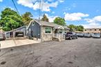 Renovated Commercial Property And Building. Auto Sales Lot. Includes 3 Hydraulic Lifts, Compressor, Ceiling Radiator, Security Alarm System, Storage Room, 3 half Baths, lobby and Office Rooms. Located On High Volume Traffic Road. Zoned C-6 Multi Use. This property is also for rent!