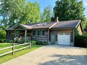 Light, bright and spacious country home, first time on the market! Cedar sided, located on a quiet cul-de-sac in the heart of the of the Hudson valley! You will love entertaining family, friends and guests in this gem with 3 bedrooms and 3 full baths, a fully finished basement for playroom, home gym, or studio space, plus your own built in movie theater! Chef&rsquo;s kitchen has new stainless-steel appliances, double ovens, gorgeous marble countertops and a large granite-topped island. The primary bedroom offers an en-suite bathroom, high wood slat ceiling and private glass sliding door to the deck and views. The Kitchen, dining area and living room is open concept with soaring high ceiling with skylights and a wood burning stove for those chilly days. There is a built-in laundry room, attached garage, cedar-sided shed, glass greenhouse. Enjoy the huge back deck under the pergola supporting a gorgeous, mature wisteria arbor and a the fire pit with built-in seats around it. An above ground pool with a lounging platform and a hot tub off the wooden deck. Beautiful and well maintained large yard with healthy mature trees. Smart home hub control panel and Nest thermostats.  This property has a remarkable VRBO rental history for over a decade with hundreds great reviews and repeat customers! Make this property your full time home, weekend home or an investment property. Minutes to the Village of Red Hook, Bard Fisher Center, Rhinebeck, Kingston Rhinecliff-Kingston Bridge, Amtrak train station, Hudson and the Taconic Parkway. Great location!