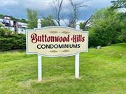 Welcome to this charming first-floor condo located in Buttonwood Hills community! With 2 bedrooms, 2 baths, and a patio, this well-maintained unit offers a galley kitchen, dining area, and living room. Enjoy access to clubhouse amenities and a community poolhouse. Ideal for those seeking convenience and community living.