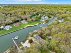 Rare opportunity to own a home on Wells Creek! This is a boater&rsquo;s dream with quick access to Shinnecock Bay and to the inlet to catch those stripers! It&rsquo;s only minutes to the water from the backyard dock where there&rsquo;s room for 2 boats up to 20 feet, or other water toys! This south of Montauk Hwy location offers quick access to hamlet shopping, dining, and the beaches on Dune Road and on the bays. This 3 bedroom, 1.5 bath cottage with gorgeous great room can be your summer refuge and retreat in the fabulous Hamptons. You have found your paradise!