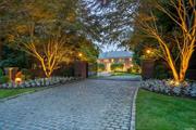 OLD WESTBURY  STONE ARCHES. Immaculate custom-built Brick Estate in the Heart of Old Westbury sitting privately on over 4 acres within a cul-de-sac location of the Stone Arches. Incredible detailing throughout the home, with extensive mill work, stunning soaring ceilings, custom moldings, luxury finishes, intricate tile accents, walls of windows, balconies, and French doors out to the back patio from multiple rooms in the home. The expansive oversized rooms within the floorplan bring vibrant energy to the home, ideal for hosting and perfectly suited for large-scale entertainment. The lower level is another floor filled with entertainment, featuring gym, theatre, wet bar, wine cellar, play/bonus room and much more. Inground pool with spa, built in bbq, expansive terraces with amazing views, and tennis court complete this incredible breath-taking property!