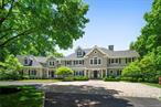 This exquisite Armonk residence offers unmatched privacy amidst landscaped grounds, showcasing a saltwater pool complemented by a stylish pergola, stone terraces, and vast lawns within the esteemed Thomas Wright neighborhood. Its timeless colonial architecture blends seamlessly with the meticulously maintained interiors. The heart of the home is adorned with reclaimed barnwood, creating a modern and refined ambiance in the family room and kitchen, ideal for informal gatherings. Formal spaces effortlessly segue into more relaxed areas, including a well-appointed library and a guest bedroom. Multiple French doors along the rear of the home open onto a covered veranda overlooking the pool and impeccably manicured lawns. The upper level presents a welcoming primary suite, two bedrooms connected by a shared bathroom, bedroom with an ensuite bathroom, and a spacious second-level family room with an additional bedroom and bathroom. The walkout lower level offers a generous gym and recreation room. A four car garage will delight the car enthusiast. Coupled with its proximity to town, this residence epitomizes luxurious living at its finest.