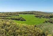 This picturesque 95+ acres of land is perfect for those seeking a building site on one of the highest elevations in Dutchess County. The existing farm road meanders through woodlands and opens to a magnificent field. As the land rises, the panoramic view is stunning, stretching as far as the Berkshire Mountains. This is a wonderful piece of land with unparalleled beauty and potential for a spectacular homesite.