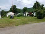 This is a cooperative mobile home community. Buyer must be 55 or over. You are not buying the land, but you are getting the right to put up a 14 x55 mobile home (lease). The buyer purchases the home and rents the land and the new owner will also own a voting share in this wonderful community. Low monthly fees probably under $550. similar to co-op housing. The basic fee is $375 additional will be the taxes. You get a share in the land and can resale the mobile home if you wish. Garbage, taxes water and sewer included in low monthly lot rent. Close to shopping, transportation, health clubs, doctors etc. This is a 55 or over senior community. Small dog allowed under 23 pounds .
