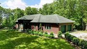 One of a kind haven in the woods. Welcome through the front door into the foyer that opens up to wide open space filled with light. Custom kitchen has sleek lines, granite counters, and stainless steel appliances. Living room with easy gas fireplace and dining room open up to the back deck and screened in back porch, perfect for overlooking your private 5 acres of serenity and comfort. First floor primary suite has more windows to take in the beauty that surrounds, tray ceiling, walk in closet, and marble primary ensuite bathroom with balcony. The finished walkout basement offers more enjoyable living space with 9 ft ceilings, family room, and two additional bedrooms, both with well appointed ensuite bathrooms. Make this your year round sanctuary or weekend retreat!