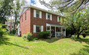 Terrific opportunity in Hudson to purchase a one owner two-family home. Built in 1980, this adorable brick duplex boasts hardwood floors, a new addition with a deck on the back of the home, and a gurgling brook running on the property. Designed townhouse style, each unit has 2 bedrooms and the full bath upstairs. The downstairs contains the living room, dining area, kitchen with laundry, and an extra room off the kitchen. One unit has recent updates. Live in one side, rent out the other. Situated in an established neighborhood, there is ample yard space and off-street parking. Located in the town of Greenport, just a few minutes from Columbia Memorial Hospital and popular Warren St., this is a fabulous find.