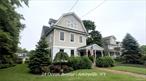 Spacious three-story Dutch Colonial family home with detached two-car garage, located at 28 Ocean Ave. Boater&rsquo;s paradise, located on Amityville River, 100 feet of bulkhead, room for up to Six boats, easy access to Great South Bay. Home is naturally elevated, has never flooded. Oversized detached garage features second level with multi-use heated area with full bath. Perfect for home office, artist studio, etc. with outside deck overlooking canal. Home has partial wrap around front porch, large rear deck with retractable awning. Premises has gazebo and mature grape arbor. Much more.