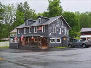Building your legacy begins with this incredible investment and life opportunity. A local turn-key restaurant tavern is available. A corner lot location just off State Route 97, in Hankins NY. Easy access to State Route 97, close to Callicoon with easy access to Port Jervis, NY. Recently updated 4, 440 sq ft bar with updated kitchen and appliances. 2 restrooms. The nice open layout of the bar and restaurant. Enclosed porch. The backyard provides a great stage for local artists&rsquo; performances. An area for outdoor eating while listening to music is a bonus. As a historical local bar, it gets great foot traffic and good volume traffic from the County Road 94. Incredible revenue-generating business, and considered part of the local community. A wonderful barn suitable for storage and more. Above the tavern is a spacious 3-bedroom, 1.5-bathroom apartment which also includes a kitchen and formal dining area. A fully open attic easily accommodates designing extra rooms of your choice