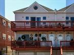 Great opportunity for individual or investor to live and rent 1 block from the ocean. Large 2 family. Each unit has 3 bedrooms, 2 full baths, open floor plan kitchen and living room, laundry, utility, CAC, 1 car garage and 1 car driveway. Lower unit has front terrace and walk out basement to rear yard. Upper unit has terrace off back with ocean views. Plenty of public parking on E Broadway.