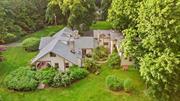 One of the earliest known surviving examples of Craftsman architecture in Redding, this rambling 1906 Arts & Crafts home, w/a 2003, 2, 000 sf addition to the period, sits on 7+ private, level acres. English cottage-style diamond paned windows, hand-cut mission woodwork, board & batten wainscoting, irregular rooflines, overhanging eaves and a 72&rsquo; front porch. Four original floor-to-ceiling fieldstone fireplaces in the spacious living, dining and music rooms, cozy library w/built-in bookshelves. Large sunny country kitchen w/white leaded glass front cabinets, island, limestone counters, stainless appliances, adjacent butler&rsquo;s pantry and milled antique barnwood floor. Oversized main floor primary bedroom suite w/french doors to patio overlooking back property and Brazilian cherry floor, travertine marble in bath, dressing area & 2 walk-in closets. 2 staircases to add&rsquo;l bedrooms plus a playroom/office and 38&rsquo; wood paneled game room. New roof and furnace. Outbuildings include a detached 2-car garage and workshop w/1 bedroom apartment above, well house, garden shed, bunk house. Charming original raised stone patio, stone walls, specimen & fruit trees, perennial gardens including iris and peony, fenced vegetable garden w/raised beds & multiple pool sites. Possible horse property. Walk to Lonetown Marsh for birdwatching & winter ice skating and concerts on the green at Town Center. This enchanting, peaceful country retreat is minutes from trains, shops, restaurants and only 60 miles from NYC. HOME WARRANTY INCLUDED. More photos to come.