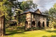 Just a short drive from the historic Upper Delaware River, 759 Hartwood Road is a bucolic paradise that is fully fenced and accessed through a pass-coded iron gate on the former grounds of the Hartwood Post Office, now transformed into a heritage compound with an 1880 local stone Main House of exceptional note, a pond-side Adirondack Guest Cottage, an architect-designed Greenhouse/Pool House/Potting Shed, the Barn and various service buildings. With 6.5 acres of exceptional private gardens, a fabulous gunite pool, meandering paths, an organic vegetable garden, a flat lawn ringed by trees and a natural pond, 759 Hartwood Road is more than an estate; it is an opportunity to create a unique venue catering to prestige events and providing potential income to an investor/owner.