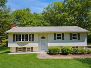 This serene homestead was loved by the same family for 52 Years. Impeccably maintained this home offers the combination of cozy features like the brick fireplace in the living room, an eat-in-kitchen leading to an oversized deck. The perfect balance of comfort and functionality. And the addition of a formal dining room adds an elegant touch for entertaining.  The large family room downstairs is a great bonus space for relaxation or gatherings. Plus, the two-car attached garage offers convenience and extra storage. But the real gem is the 6.9 acres of land! With trails to explore breathtaking views, and unforgettable sunsets, It&rsquo;s the nature lover&rsquo;s paradise. The 800 sq foot barn adds even more potential, whether it is used as an artist studio, storage, or any other creative endeavors. The perfect blend of comfort, functionality, and natural beauty. If you are looking for a peaceful retreat with plenty of space to roam and enjoy the fresh air and starry skies , this home is for you.