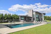 This spectacular contemporary is filled with natural light and offers stunning mountain views from every window. This home in Callicoon&rsquo;s beautiful Beechwoods area is architect-designed and visually arresting from any angle--inside and out. With plentiful rooftop solar panels, lots of double- and triple-paned glass, a radiant polished concrete floor, and Nest thermostats, it is so energy efficient that it streams excess electricity back into the grid. The pool-patio complex is completely private -- perfect for relaxing and entertaining. Inside, the sleek, minimalist design in gray, black, and white is soothing and provides a neutral background for your taste in furnishings. The chefâ€™s kitchen is spacious, with granite counters and island, Miele appliances including an induction stovetop, 2 wall ovens, wine cooler, and more. The soaring double fireplace provides ambience inside and out. A first-floor guest suite has a bedroom, full bath, and living/bedroom â€“ and closes off for privacy. Upstairs are 2 more bedroom suites, each with its own full bath. The primary bedroom has 2 full baths and walk-in closets. Laundry with W/D. Full-house Sonos sound system. Outside, gardeners will appreciate the fenced, raised-bed garden and the apple and pear trees. And everybody will value the quality of life that comes from peace and quiet, beautiful Catskills views, and proximity to the vibrant hamlet of Callicoon and the Delaware River. 2 hours NYC. Additional Information: Amenities:Guest Quarters, ParkingFeatures:1 Car Attached,