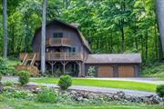 Tranquil Cedar Contemporary Home in Hudson Valley - A Perfect Retreat.Looking for unparalleled privacy, serene surroundings, and the beauty of nature? Thisdistinctive 3, 164 sq. ft. cedar contemporary home offers all that and more, creating the ultimate peaceful retreat in the Hudson Valley. Nestled on 1.8 scenic acres and set back from the road, this property provides the perfect combination of seclusion andconvenience. A spacious wrap-around deck invites you to relax, listen to birdsong, enjoy a barbecue, or entertain friends and family in style. Situated in an upscale neighborhood, the multi-level layout of this nine-room home is ideal for both family livingand quiet getaways. The first level features an expansive family room, perfect for gatherings, and two generously sized bedrooms offering flexibility for guests or additional living space. On the second level, a breathtaking two-story great room takes center stage, complete witha striking brick fireplace and a balcony that overlooks the space. Adjacent to this is a designer kitchen, remodeled in 2013, boasting custom maple cabinetry, quartz countertops, stainless steel appliances, and a cozy breakfast nook. An additional roomon this level can function as a bedroom or a home office. The third level is dedicated to the primary suite, which offers a spacious bedroom, aluxurious en-suite bath with dual vanities, and sleek quartz countertops. This home has been thoughtfully maintained, with roof shingles and the chimney replaced in 2013 for lasting durability. A two-car garage provides ample storage and includes space above, offering potential for expansion. Located just minutes from schools, Washingtonville Village, Woodbury Commons, shopping malls, Route 17, I-87, and the Palisades Parkway, this property is also convenient for NYC-bound train and bus commuters. Here, youâ€™ll enjoy the perfect balance of tranquility and accessibility. Whether you&rsquo;re seeking a peaceful family residence or a private retreat, this unique Hudson Valley home offers an exceptional lifestyle opportunity.