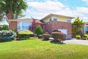 Spacious Split in Westbrook Park Section of Levittown , Open and Airy LR, Formal DR, Eik has Sunny Breakfast Area, with bow window overlooking the yard,  Primary BR has Bth, & Sep Laundry with Washer & Dryer, , Two more nice size BRS & Updated Bth  Den has New floors &, Ceramic Expanded Bth. Bsmt is finished with New Floors.iand High Hat Lighting . Hardwood Floors as seen thruout. Oil Burner and Oil Tank 2 Yrs old, Poss. M?D with Permits,  East Meadow Schools,  Conveniently located for Shopping, Restaurants, Community Pools. .Parkways and LIRR  .