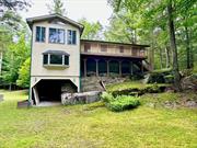 Welcome to 48 Galia Road located in the highly desirable community of Smallwood in the Town of Bethel NY. The Zillow map location is wrong. This home is in Smallwood just west of Mountain Lake. This home is very unique and is built right into the hillside on a large rock. A photo says a thousand words so please take a good look at the photography. The living room sports a 14&rsquo; high cathedral ceiling with a 12&rsquo; Ole brick wall. The fireplace also features an oak timber mantel & rising beam, with a 13&rsquo; stone hearth. There is a built in 12&rsquo; x 18&rsquo; carport. A door can be installed to make it a 1-car garage. There is a built-in fully wired tool shed & wood shed. This home has its own septic system and well. It makes a great year-round or summer home as well as an excellent vacation rental. The home sits on 1.98 acres comprised of 4 separate lots. SBL&rsquo;s 43.20.2, 43.20.3, 43.20.4, 43.20.7. You can even build another house or sell an acre and a half of the property to pay off part of the house. Smallwood is located in the center of Sullivan County only 100 miles outside of Manhattan. This home is close to Mountain Lake in Smallwood and is also located close to White Lake where there is plenty of action and several great restaurants. It is also not far from Monticello where you will find things like ShopRite, Walmart, Home Depot as well as Resorts World Catskills casino.