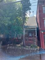 Attention investors! Beautiful late 19th century arts and crafts style house that has been well maintained. Hardwood floors throughout, modern bathroom, dry basement, plenty of space. Great long-standing tenant. Fenced in private backyard.