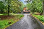 Welcome to your contemporary oasis in beautiful Lake Huntington, NY! This immaculate home boasts charm and convenience at every turn. Step inside to discover a spacious interior flooded with natural light, highlighted by stunning features such as a Romeo and Juliet balcony off the ginormous master suite. With a total of 3 bedrooms and 2 full bathrooms, this home offers ample space for relaxation and entertainment. Large closets throughout ensure plenty of storage for all your needs. A blacktop driveway and attached 2-car garage provide convenience and ease of access. Nestled on over 3 acres of land, this property offers unparalleled privacy, making it the perfect retreat from the hustle and bustle of everyday life. Enjoy the serene surroundings from the comfort of your own home, or step outside to explore the expansive grounds. Additional features include a walkout basement, perfect for expanding your living space or creating a home gym, and a cozy woodstove for chilly evenings. New flooring on the first level adds a touch of luxury, while tung and groove walls exude rustic elegance. Whether you&rsquo;re relaxing in the sitting room or hosting guests in the open-concept living area, this contemporary home offers the perfect blend of comfort and style. Don&rsquo;t miss your chance to make this stunning property your own! Additional Information: ParkingFeatures:2 Car Attached,