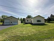 Well maintained three bedroom,  two bath ranch with 30 X 40 pole barn. Located on a dead end street just 2.5 miles from Village of Saugerties on over a half an acre.  Cathedral ceilings with sky lights, radiant heated floors and two picture windows greet you as you enter the home.  The spacious living room overlooks the great room and leads into the eat- in kitchen.  Kitchen with dining area boasts custom cabinets, granite counters, breakfast bar and stainless steel appliances.  Sliding glass doors lead out to covered Trex porch overlooking level, private backyard.  Primary bedroom off the living room has large walk in closet, bathroom with Jacuzzi tub,  glass block and tiled shower. Two bedrooms , one with hard wood floors and another full bath are located on opposite side of home. Bonus mudroom with separate entrance and laundry closet.  Full basement with brand new furnace and finished 720 square feet not included in total square footage. The metal pole barn is of great value to anyone looking for a studio space,  garage for large vehicles or work shop with separate 100 amp service.  The garage on the right is heated with ample room for two cars. Just a short drive off of Exit 20, close to Hunter Mountain Ski Resort, hiking trails in the Catskill Mountains and close to towns of Woodstock, Catskill and Kingston. Just listed for $574, 900