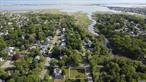 Land Sale includes ALL PERMITS! This corner lot is a rare find, offering Town of Brookhaven building permit as well as Wetland Permit, Suffolk Country Health Department Permit, and NYSDEC for your convenience. Located near Smith Point Beach at Fire Island National Seashore, this picturesque location is perfect for building your dream home. Enjoy a tranquil setting overlooking John&rsquo;s Neck Tidal wetlands and access to the Great South Bay for water activities. The proposed two-story house, designed by an award-winning architect, is tailored for relaxation and outdoor living. With a secluded entry porch and an old-growth oak tree gracing the entry court, this property exudes charm. Inside, you&rsquo;ll find a spacious living room and an open kitchen with a south-facing expanse, perfect for enjoying the garden porch. Detailed floor plans and a 3-D model are included to help you visualize your future home. Extensive permitting, including two wetlands permits, has been pursued for several years to ensure a smooth building process. Additionally, the property offers a scenic sunset view over the wetlands, adding to its appeal. Don&rsquo;t miss out on this idyllic setting in the beautiful Fire Island National Seashore.