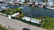 Need to find your boat a home? This 50x100 waterfront vacant land is located on the 19th Road canal! Located near Sunset Cove in Broad Channel, Queens. This private oasis comes with the option to install a catwalk complete with a float, subject to approval by the Department of Environmental Conservation (DEC). To further sweeten the deal, owner financing is available, making this opportunity even more accessible and enticing. NOT A BUILDABLE LOT FOR A HOUSE.