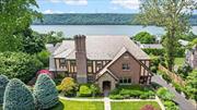 Year round Hudson River views and endless sunsets over the Palisades! Step into the epitome of refined living at this stunning 1923 Tudor home nestled within the serene riverside community of Woodstock Manor in NW Yonkers. This residence is impeccably maintained with meticulously landscaped gardens, and boasts original charm with 5 Bedrooms, an expansive Kitchen that invites culinary creativity, Formal Dining Room, Living Room with original limestone fireplace, Library, heated Sunroom and original hardwood floors throughout. Ascend the grand central staircase revealing the hidden treasures of the bedroom level. Back stairs to the third-floor reveal the unfinished attic offering boundless possibilities. The lower level serves as a versatile retreat, with Multi Purpose/Home Office, Family Room with Beverage Bar, Spacious Bedroom and Half Bath opens out to a charming stone patio and verdant garden oasis. Graceful architecture, lush surroundings and amenities, this residence offers a lifestyle of unparalleled sophistication. Make this dream home yours today. Do Not Follow GPS to this property! Take only Exit 9, Executive Blvd from the Saw Mill Pkwy. Property is 2 turns from exit 9.