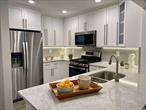 Ask About Our Outstanding Specials*; Shaker-style cabinets. Quartz ctrtop/backsplash/plank tile flr. Bath: frmls shwr drs/subway tile /quartz vanity. Hi-hats.Ceil fans.Whirlpool gold ser.SS Appl. WD.Gray paint/crpt. Central gas heat/air/Gym/Pool/Rt 495 x40/nr LIRR. Jericho schools #1 national-Niche survey. *May change w/o notice.