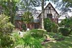 This beautiful English Tudor home with wonderful original details is located on a charming street in Old Edgemont - just a short walk to Scarsdale Village shops and restaurants, the Metro North train to NYC ( 30 min.), Seely Place Elementary School and the Edgemont Jr. / Sr. High School. This 4 bedroom home features a spacious living room and dining room, a beautiful sunroom located just off of the eat-in-kitchen, a primary bedroom suite with updated bath, 3 bedrooms with an updated hall bath, and is situated on almost 1/3 acre. There is plenty of space for comfortable family living and entertaining, both indoors and outdoors. If you are not quite ready to purchase a home, there is no better introduction to suburban living and the Edgemont School District than 27 Bretton Road!