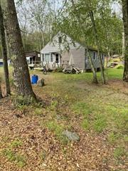 Come finish the renovation! Cabin at Mohican Lake was partially stripped with the intention of a cosmetic upgrade which was never completed. A 3-season, 3 B/R, 1/2 bath + sep. shower room with washer and dryer. 4yr old septic tank and we&rsquo;ll is less than 15 yrs. Each B/R fits a queen size bed. Great room with Kitchen, D/R, & L/R with beautiful lake view. Pull down stairs to wide open stand-up attic with plenty of potential! Back deck out to yard with firepit and woods beyond. Privacy! Front deck with beautiful view of the lake. Enjoy swimming, boating, kayaking, paddleboarding, fishing and more! Less than 500 ft from the Association boat launch and picnic area. Membership is optional, but membership is only $100/year! Hunting on nearby state lands. Several rod and gun clubs in the area as well. Less than 20 mi from skiing and snowboarding, Bethel Woods Center for the Performing Arts, Forestburg Playhouse, and the Delaware River Come enjoy!