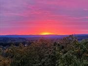 Breathtaking views of the Hudson Valley in this Contemporary Home, a custom build, The home features passive solar to lower your energy costs. As you walk through the home you will appreciate the amount of natural lighting in all of the rooms. There are 3 spacious bedrooms and 2 Full baths and 2 half baths. The primary bathroom has been updated. There is an additional room that could serve as a media room/game room or office. Throughout the home are large closets. Spend the fall taking in the colors of the valley while sitting around your firepit.  The upstairs and downstairs are finished with multiple walkout points. Expansive 3.3 Acres generous lot offers endless possibilities for outdoor activities, gardening, or simply soaking in the natural beauty. There is a large 2 car garage with electric and additional storage above. The house sits with a West view for amazing sunsets and has large windows throughout the home and 14 foot ceilings. Additional Information: ParkingFeatures:2 Car Attached, Appliances: Electric Water Heater ConstructionDescription: Wood Siding,