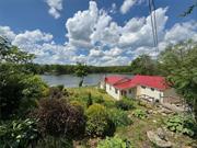 Introducing &rsquo;The Boat House&rsquo;  a rare lakefront gem with private dock and walkable access to Huckleberry Ridge State Park. Immerse yourself in nature while just minutes away from trendy destinations like Port Jervis, Milford, and Warwick. Meticulously restored with love, this cabin boasts original wood floors, a grand stone hearth fireplace, and rare Pecky Cypress walls. Enjoy breathtaking lake views from every room, surrounded by untouched natural state land. A professional garden blooms from Spring to Autumn. Other features include dedicated parking, sizable garage, and expansive lot with two waterfront side yards. Experience ever-changing lake views and abundant. sunlight throughout the day - punctuated by amazing sunsets from your dock! Top-rated Minisink school system  seize the opportunity to make this your home.