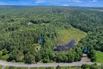 Opportunity is knocking -- Start a new venture, or Make it your dream home, this versatile property can make it all happen herefor you! Imagine -24.9 Acres with a stunning natural Pond, a 3 Bedroom 1 Bath Ranch Home and a separate storefront Building- ALL INCLUDED IN SALE TOGETHER - plus in a desirable location - Country yet close to the City of Port Jervis for all services, restaurants, shopping, the Metro-North train and access to I-84 Hwy. This unique property has been owned by the same family for generations and is offered for the first time. The ranch home sits back up the lane with relaxing views of the pond to enjoy and lots of pretty backyard acreage frequented by wildlife. Inside the home the Star of the Show is a custom natural stone fireplace built by the owner with a wood insert for extra warmth during the cooler seasons. This Well built home with a newer roof, hardwood floors and full basement is just waiting to be enhanced with your updating. The separate store building along Rt 42 has a parking lot and was used by owner to market goods. This exceptional property combines the best of rural charm with practical amenities creating an inviting retreat for both personal enjoyment and entrepreneurial possibilities - loads of potential to be all your lifestyle requires. Year-round or vacation, you&rsquo;ll know you made the Right Choice every time you drive up the lane and take in all its refreshing natural surroundings. This is the right time to consider owning such a remarkable property!