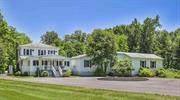 This spectacular Hudson Valley getaway is set among meticulous and beautifully landscaped grounds in one of the region&rsquo;s most exciting small towns. It is the epitome of country charm, elegance, and comfort, and it serves up a lifestyle filled with recreation and relaxation. Take a tour of 532 Springtown Road in New Paltz and imagine your life anew. A spacious 3-bedroom, 2.5-bathroom contemporary farmhouse, this completely updated home offers the perfect blend of privacy plus convenience for weekend retreats or full-time living plus an added bonus of income potential. The house, set deep within the almost 20 acre property, is revealed at the end of a long driveway that blends into in a circular parking area - this is where the fun starts: a landscaped firepit beckons on the expansive, open lawn; a luxurious, heated, saltwater pool presents endless summer fun; multi-level decking and a gorgeous stone patio adorned with roses and a lavender garden offer spaces for refined entertainment - here, you and your guests can forget the world, enjoying the natural beauty of the Hudson Valley that&rsquo;s on display from every vantage point and corner of this beautiful country acreage. Behind the house, the detached garages (one 2-car, and a second one-car) offer plenty of storage space for toys, tools, and vehicles. Enter through the home&rsquo;s porch into a sunny foyer large enough for lounging and conversation in front of the woodstove. Inside, you&rsquo;ll discover the open-concept living space which is the home&rsquo;s centerpiece attraction. Beautiful hardwood floors and ambient lighting flow between the gourmet kitchen, the cocktail bar, the entertainment room with its sunken hot tub and wood-burning fireplace, the luxurious full bath, and the office/guest bedroom. Nestled off the kitchen find the coffee bar to sip your morning roast and a separate laundry room. The main level is home to the private, primary bedroom, complete with seating areas, double closets, and an en suite bath. Upstairs you&rsquo;ll find two large bedrooms, each with hardwood flooring, plenty of windows, and ample closet space, as well as a third, full bathroom. Minutes to the delightful Village of New Paltz, you can begin your day on the deck to soak up the morning sun with your coffee, head into town to browse the charming local shops, cafes, and galleries, and visit the nature preserves (Mohonk, Minnewaska) and trails that draw people here from the city. Then return home at day&rsquo;s end to gaze up at the stars, watch the firefly show and toast s&rsquo;mores at the firepit. This is, quite simply, the perfect home, made extraordinarily perfect by income potential and the opportunity to purchase it furnished. Visit 532 Springtown Road in New Paltz - it will change your life.