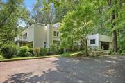 Stunning contemporary home in one of the most desirable, centrally located Pound Ridge settings. Just across from the walking path, effortlessly stroll into town, the parks, and more. YES, it truly is a walkable location. This home is complemented by oversized windows integrating the beauty of nature into every room. HW floors lead to the walkout living room with an eye-catching fireplace. Dream kitchen boasts SS appliances, propane gas cooking, custom cabinetry, prep sink, luxurious quartz c-tops & more. Enjoy your morning coffee fr the primary ensuiteâ€™s balcony or the sun-kissed reading nook. The walk-out lower-level family room is ready for movie nights, playdates, or whatever merriment you have in mind. Send your Evites, the circular driveway accommodates many guests while offering complete privacy. A full house generator, TWO well-sized yards, and an EV outlet round off this home in picturesque Pound Ridge.