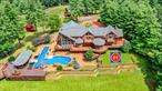 Welcome to the most spectacular home in Sullivan County. Located on a 30-acre hill overlooking the Swinging Bridge reservoir the largest lake in Sullivan County. This estate is built with the finest of everything. All top-quality materials built and crafted with amazing details. This mansion comes with a four-bedroom guest house, and a caretakerâ€™s apartment over the barn. The grounds are spectacular and have paved roads leading to the house, guest house, barn, and the Tennis & Basketball courts as well as the the concrete boat ramp.at the lake. Floor-plans have been uploaded to the MLS. Additional Information: Amenities:Guest Quarters, HeatingFuel:Oil Below Ground, ParkingFeatures:3 Car Attached,