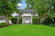 Charming American Colonial-style home with delightful living spaces. Enter through the spacious foyer/enclosed porch. The first floor is bathed in natural light from French doors and windows and includes a powder room for convenience. The renovated kitchen, with an attached breakfast room, opens to a patio for fresh air and outdoor dining. The second floor features a spacious primary bedroom with a walk-in closet and renovated en suite bathroom, plus two additional bedrooms and a hall bathroom. Hardwood floors throughout add timeless appeal. Situated on a tranquil street, this home offers easy access to highways and public transportation. A quick 35-minute train ride to New York City makes commuting easy.