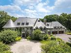 This spectacular limestone French Manor estate sits on 10+ acres on Converse Lake with 100&rsquo;+ of lakefront in exclusive Conyers Farm, a guard gated community with private security. Custom designed for the current owners by architect James Davis, this meticulous home features impressive attention to detail. The main & garden level of the home are ideal for entertaining with an oversized great room, music room, formal living and dining room with double-sided fireplace. Many rooms open onto the terraces overlooking the lake and pool. The master bedroom suite is comprised of 3 rooms; sleeping room, sitting room with a balcony and luxurious onyx bath. The four finished floors of living space feature 8 bedrooms, 11 full baths, 2 powder rooms, a full gym, indoor half basketball court with NBA 3-point line, a steam room, home theatre and every modern amenity. The grounds include a heated pool & spa, golf green & playground. There is a separate pool kitchen with dining area and changing rooms. Additional Information: Amenities:Dressing Area, Marble Bath, Soaking Tub, Storage, HeatingFuel:Oil Above Ground, ParkingFeatures: 4+ Car Attached,